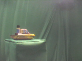 45 Degrees _ Picture 9 _ Brown Toy Sailboat.png